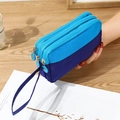 Three-layer blue nylon wristlet phone bag with zipper compartments and hand strap - Light Blue