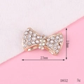 Macro shot of 23x14mm golden bow charm with AB rhinestones for DIY phone accessories - D852 Small Rhinestone Bowknot