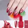 Detail of red metallic mirror nail polish bottle and brush application on nails - 04 Mirror Red