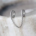 Macro shot of silver chain earrings with cubic zirconia inlay for double piercings - Silver with Stones