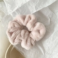 Close-up of soft pink faux fur scrunchie with fluffy texture and voluminous design - Light Pink