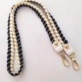 Detailed view of woven blue and cream cotton strap with gold metal lobster clasps - 80cm / Navy Blue
