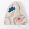 Cream white knitted beanie hat with embroidered love dreams patches for kids and adults - Beige