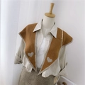 Brown knitted shawl wrap with beige trim and heart pattern on a mannequin display - Knitted Pointed Heart Caramel