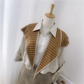 Brown striped knitted shawl scarf accessory on a mannequin for autumn and winter outfits - Knitted Pointed Striped Caramel