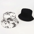 Detail of reversible tie-dye marble pattern and solid black cotton sun bucket hats - One Size / Black Grey White Tie-Dye (Reversible)