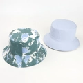 Flat lay of tie-dye and light blue reversible cotton bucket hats for sun protection - One Size / Cyan Blue White Tie-Dye (Reversible)