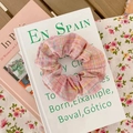Pink checkered organza scrunchie with yellow and blue stripes on a decorative book - Strawberry Plaid
