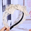 Lace bow headband with embroidered flowers and artificial pearls shown in cream white - Bowknot Style / Cream