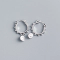 Detail of S925 sterling silver hoop earrings with sun pattern round pendants - 925 Silver / Platinum Silver Color (Pair)