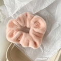 Close-up of soft light pink plush scrunchie with fluffy texture for winter hair styling - Orange Pink