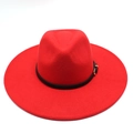Close-up of red wool fedora hat crown featuring black leather band and gold buckle detail - Red