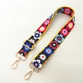 Detailed view of dark blue floral shoulder strap with gold metal buckles and adjuster - Dark Blue Floral - Silver Buckle