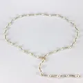 Elegant gold wavy chain necklace featuring white pearls and a sparkling diamond leaf pendant - Pearl Maple Leaf Rhinestone Clasp