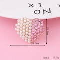 Macro shot of heart-shaped alloy charm with pink rhinestones and pearls, 28.5mm wide - D984 Heart Pink