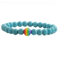 Blue turquoise beaded bracelet with a rainbow charm on a clean white background - Blue Turquoise