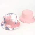 Flat lay of tie-dye and solid pink cotton bucket hats for sun protection - One Size / Dusty Pink Grey White Tie-Dye (Reversible)