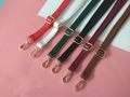 Detail view of adjustable PU leather shoulder straps in six colors with gold hardware - White