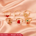 Set of 6 Christmas rings with reindeer and tree charms on peach satin fabric - Reindeer Ring Set (3170)