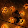 Halloween pumpkin LED string lights with warm orange glow and smiling faces in a basket - Hollow Pumpkin (4.1 Cm)