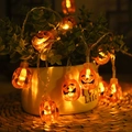 Halloween orange pumpkin LED string lights wrapped around a ceramic pot for festive decor - Solid Pumpkin (2.5 Cm)