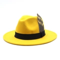 Macro shot of bright yellow wool fedora hat featuring black band and spotted feather detail - M (56-58cm) / Yellow
