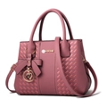 Elegant dusty rose faux leather handbag with woven texture and heart charm detail - Pink