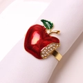 Christmas red apple napkin ring with gold finish and rhinestone details on white napkin - Apple