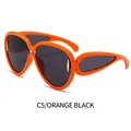 Lunettes de soleil oversize orange tendance avec verres noirs et détails dorés - Monture Orange Verres Gris