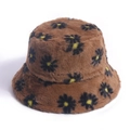 Close-up of brown plush faux fur bucket hat with black and yellow daisy embroidery - 58cm / Brown