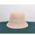 Close-up of beige knit bucket hat featuring vertical ribbed chenille texture and wavy brim - M (56-58cm) / Beige