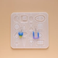 Detail of DIY silicone mold featuring various geometric shapes for resin earring making - Earring Pendant Collection Mold