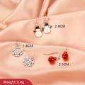 Three pairs of Christmas earrings featuring snowman, snowflake and red bell enamel designs - Snowman Earrings B (8267)