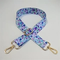 Detail of adjustable floral wide bag strap with blue blossoms and gold swivel hooks - No.8 Blue Floral