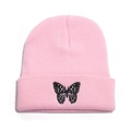 Close-up of pink knitted beanie with detailed black butterfly embroidery on the cuff - M (56-58cm) / Pink