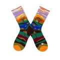 Detail of crew socks featuring a colorful African savanna landscape with trees and animals - One Size / African Jungle
