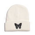 Close-up of butterfly embroidery on a cream-white knitted beanie with folded cuff - M (56-58cm) / White
