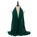 Elegant emerald green pearl chiffon hijab scarf draped on a mannequin for styling - Dark Green