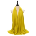 Elegant solid yellow pearl chiffon hijab scarf shown on a mannequin torso - Mustard Yellow