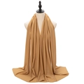 Elegant camel plain pearl chiffon hijab scarf draped on a mannequin in a long length - Khaki