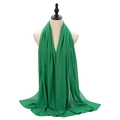 Elegant green pearl chiffon hijab scarf with soft draping on a mannequin - Dark Green