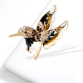 Elegant hummingbird brooch with colorful rhinestones and enamel on a white stand - Black Bird