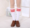 Close-up of white knee-high socks with red stripes paired with brown vintage shoes - One Size / White with Red Stripes