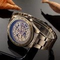 Macro detail of bronze skeleton watch movement with tachymeter scale and polished reflection - Bronze Steel Strap (With Lettering)