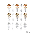 Detail view of 81 self-adhesive facial rhinestones in orange, white, and pearl tones - ET-16 Multi-color Rhinestone Pearl Set