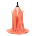 Elegant peach coral pearl chiffon hijab long scarf draped on a mannequin bust - Pale Chrysanthemum Pink