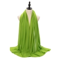 Lightweight green pearl chiffon hijab scarf with soft drape for women on mannequin - Emerald Green