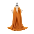 Orange pearl chiffon headscarf draped on mannequin showing soft texture and length - Ginger Yellow