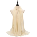 Elegant pearl chiffon hijab in cream beige color displayed on a mannequin head - Beige
