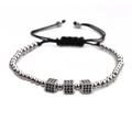 Detail of adjustable black woven bracelet with silver beads and black zircon cubes - Silver 3 Cubes